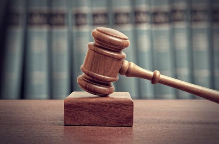 A worker was sentenced to death for the premeditated murder of a businessman and his wife.